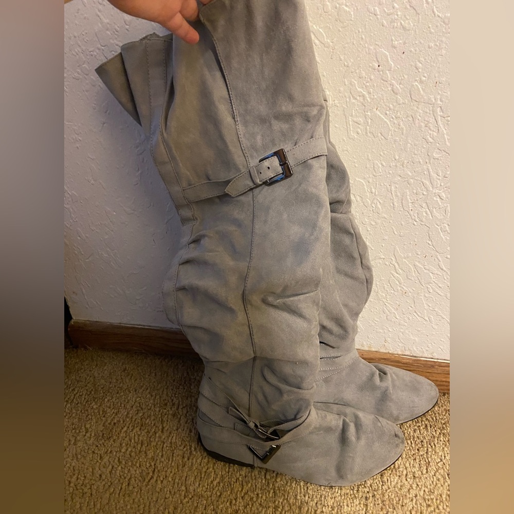 I’m selling these knee high grey boots!! So cute!